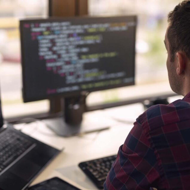 Employee working on computer code